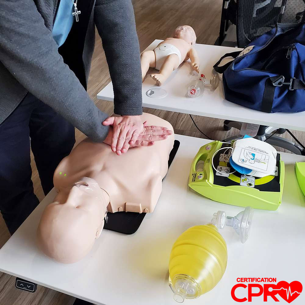 CPR training on mannequin for certification in West Palm Beach.