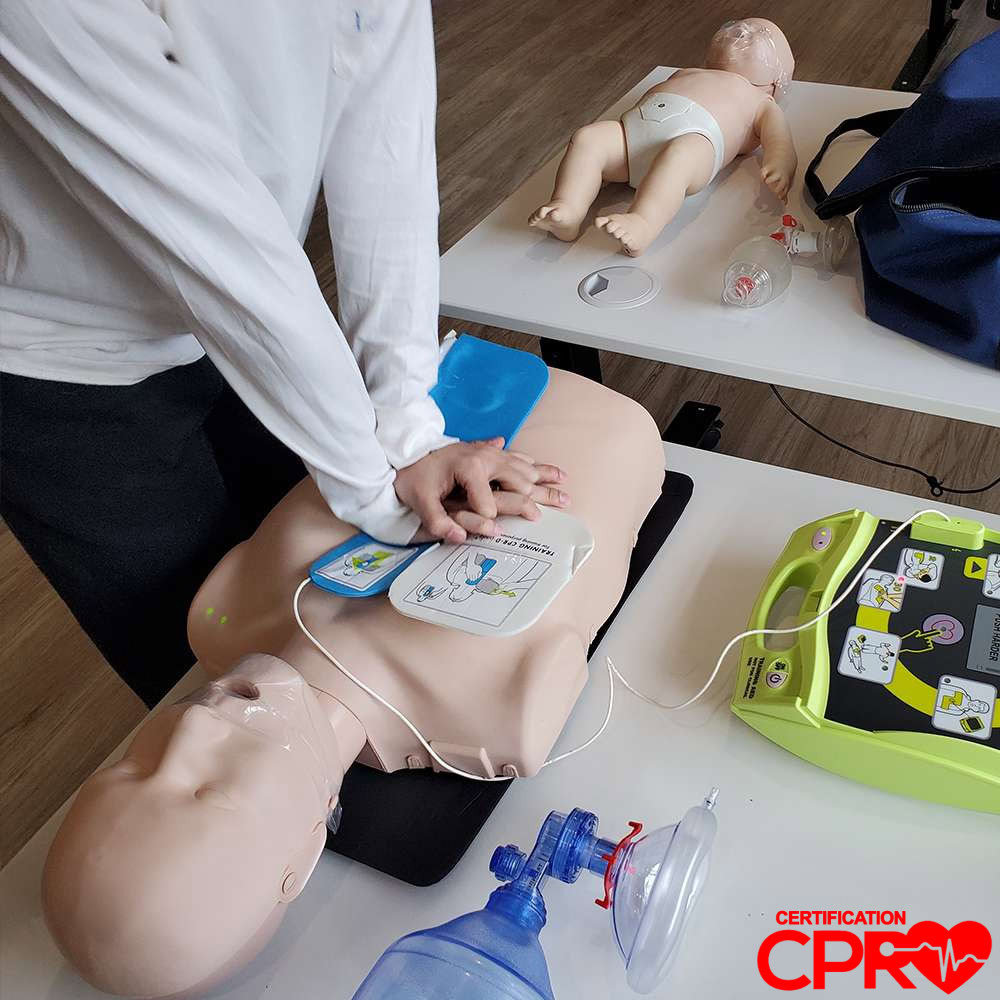 CPR training with mannequin and AED for certification in West Palm Beach.