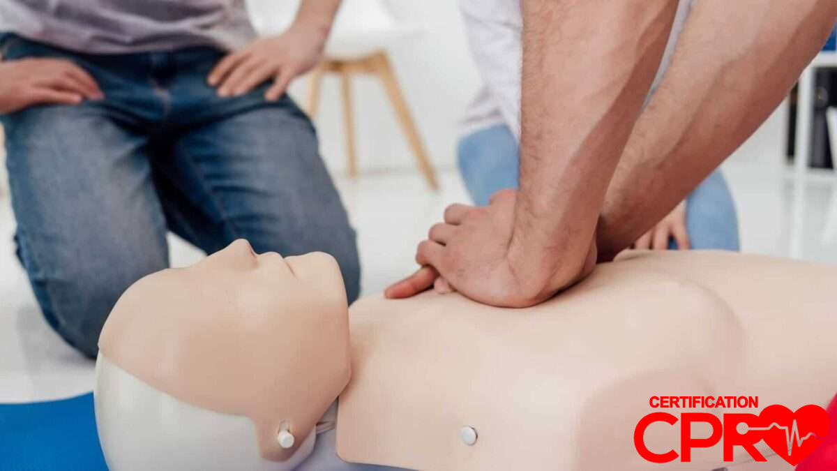 CPR training session with a man practicing on a mannequin in West Palm Beach.